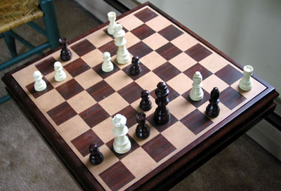Picture of a chess board, with about 15 pieces remaining